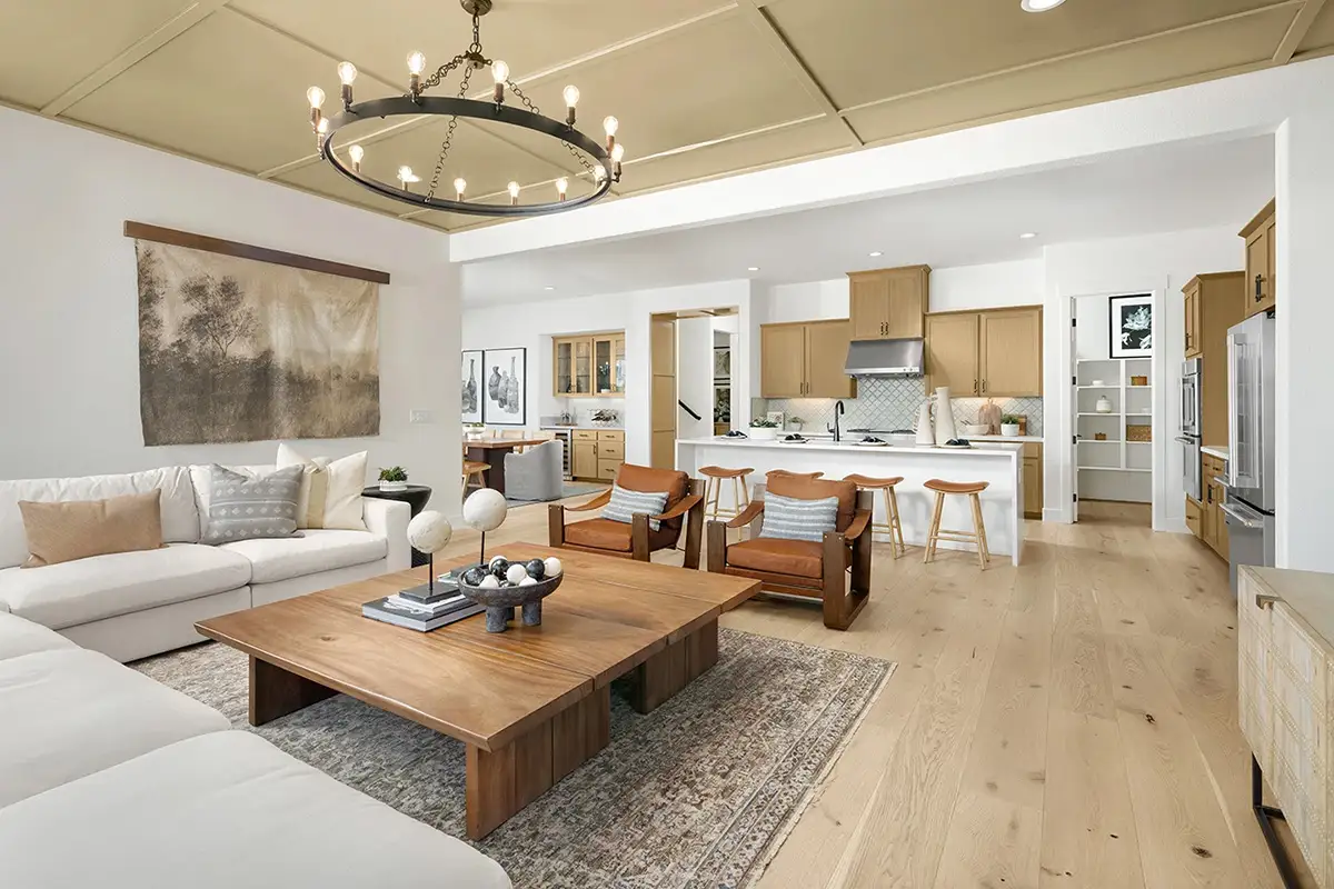 Beautiful kitchen with brown cabinets, white walls and elegant fixtures