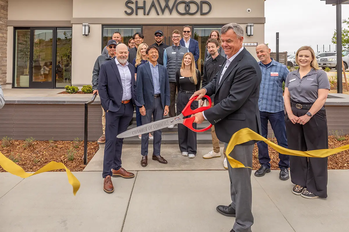 Ribbon cutting ceremony at a SHAWOOD home